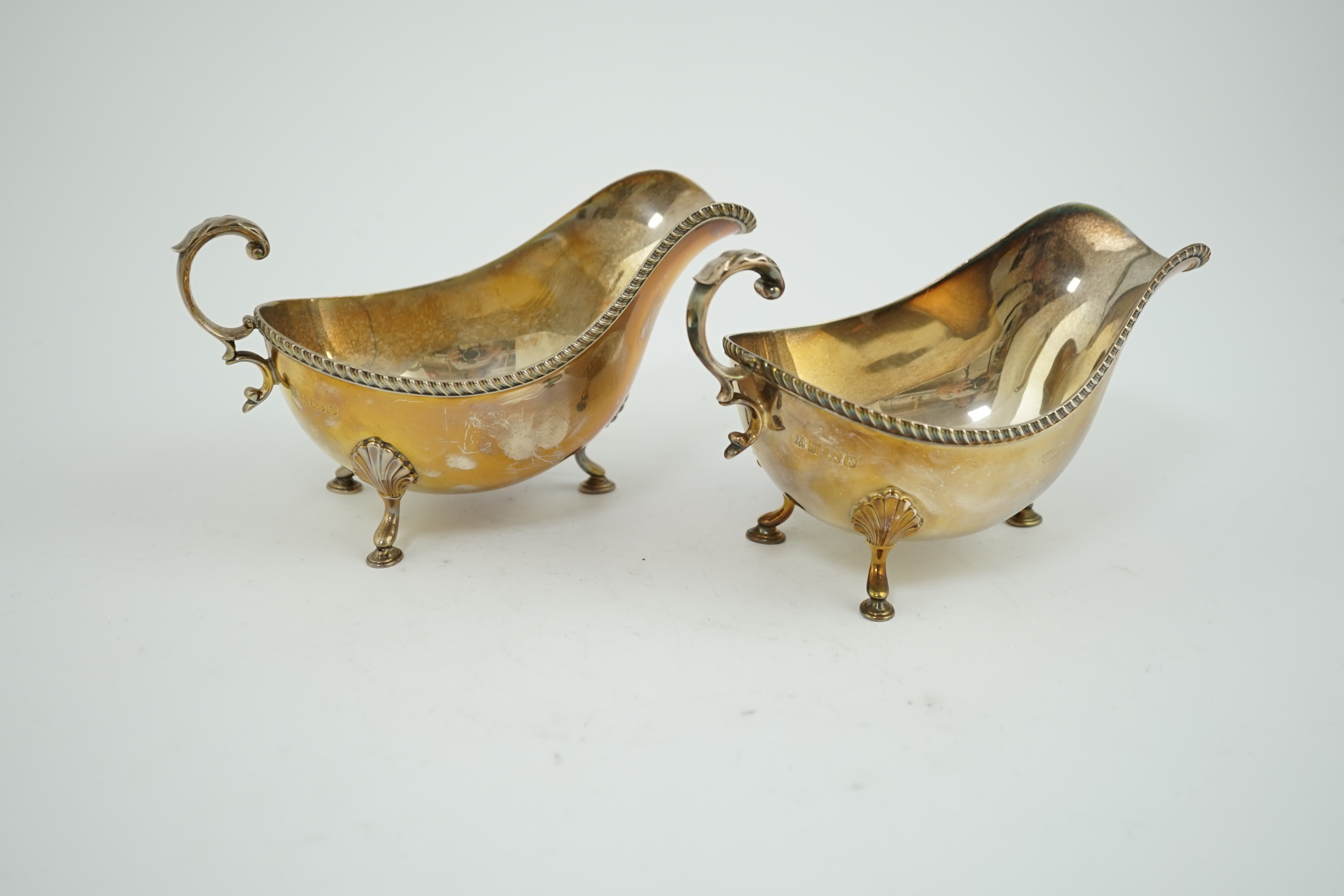 A pair of Elizabeth II silver sauce boats, by Barker Brothers Silver Ltd